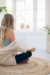 Woman meditating to reduce stress and improve immunity naturally